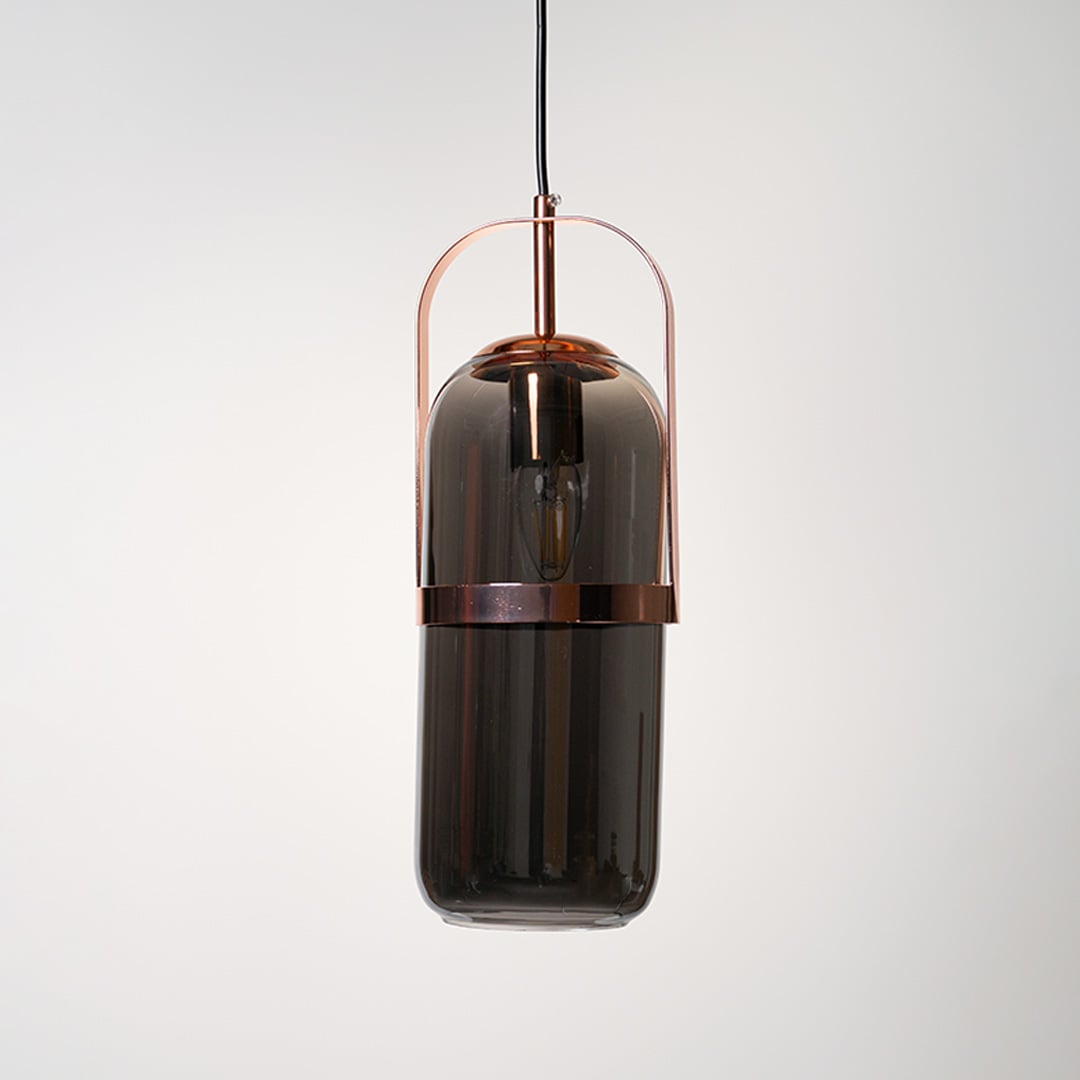 Smoked glass pendant lamp with copper frame in elegant design perfect for modern interiors.