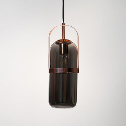 Smoked glass pendant lamp with copper frame in elegant design perfect for modern interiors.