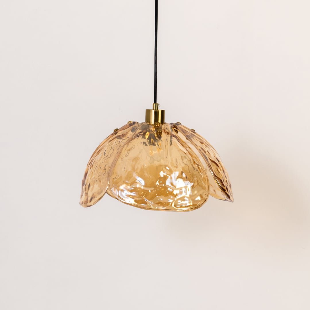 Amber textured glass and gold metal pendant light showcasing artistic design for elegant interiors.
