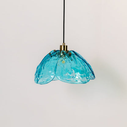 Blue textured glass and gold metal pendant light designed for modern kitchen and dining room decor interiors.