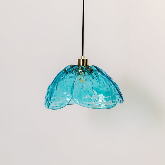 Blue textured glass and gold metal pendant light designed for modern kitchen and dining room decor interiors.