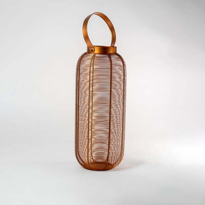 Unlit copper wire lantern featuring a stylish modern design with a handle displayed on a pristine white background ideal for contemporary home decor.
