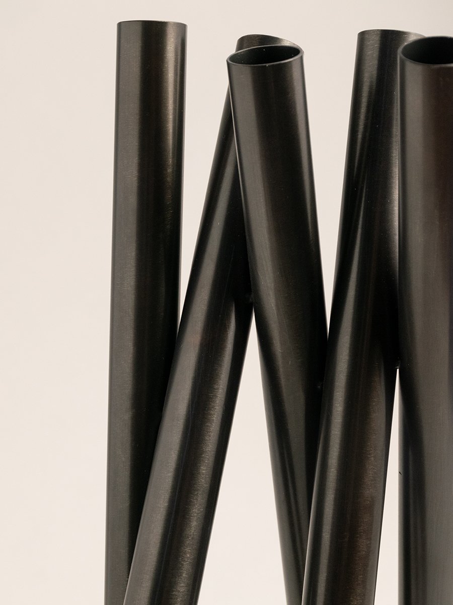 Set of black metal candle holders with geometric forms for contemporary tabletop styling and modern home decor.