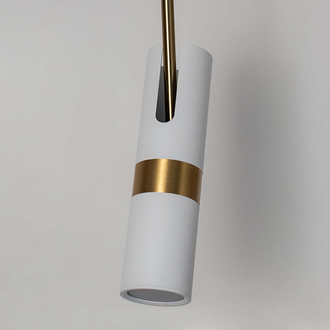 Closeup of elegant white and gold cylindrical pendant light with sleek modern design perfect for luxury home interior lighting.