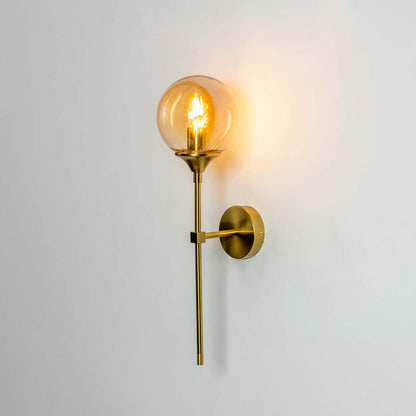 Modern brass wall light with sleek geometric metal frame for elegant contemporary interior decor.