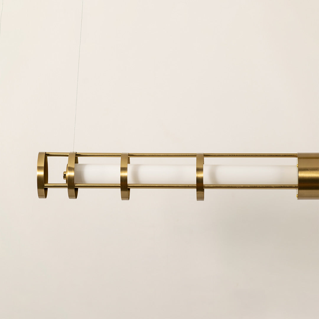 Gold metal LED pendant light showcasing frosted diffuser detailing and premium craftsmanship for modern ceiling lighting.