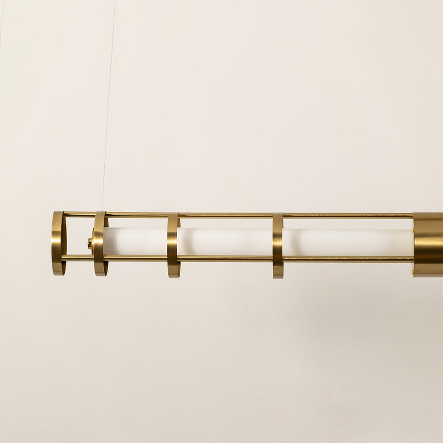 Gold metal LED pendant light showcasing frosted diffuser detailing and premium craftsmanship for modern ceiling lighting.