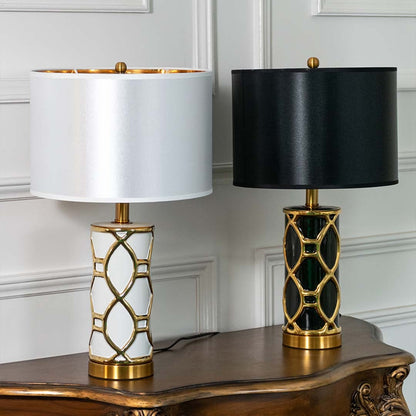 Set of elegant gold and white ceramic table lamps with fabric shades styled for classic living and bedroom interiors.