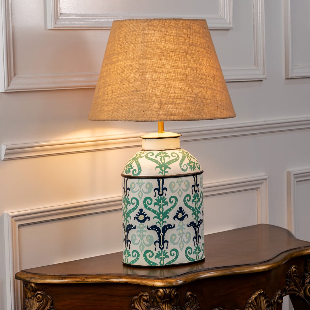 Royal Baroque table lamp illuminated on white background showcasing ornate detailing rich glow and luxurious interior decor statement.