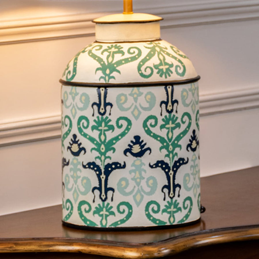 Table lamp closeup highlighting a mint green ceramic base with intricate traditional floral patterns and fine craftsmanship.