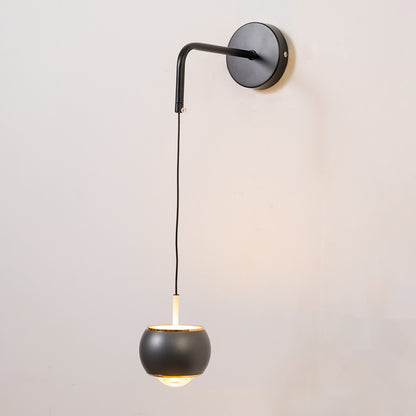 Contemporary wall light in black metal finish with hanging globe shade for bedroom or living decor lighting white background.