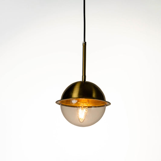 Modern pendant light with gold and white dome shade and hanging cord placed against neutral wall background showcasing elegant contemporary lighting decor styling.