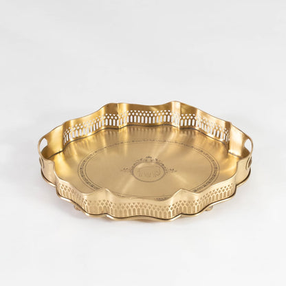Flat brass tray with decorative rim and side engravings shown in front view against a clean white backdrop.