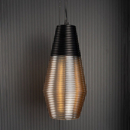 Black and amber glass pendant lamp with ribbed texture shown against black background for elegant home interiors.