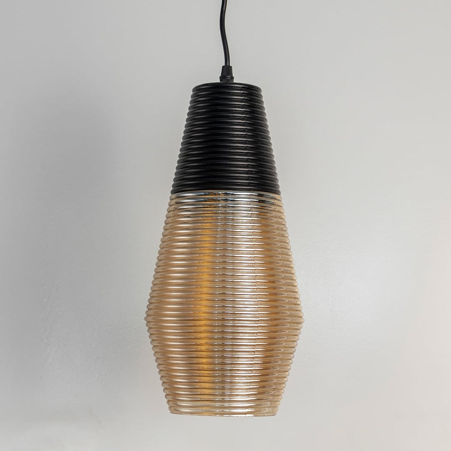 Black and amber ribbed glass pendant light displayed on white background ideal for modern home and dining decor.