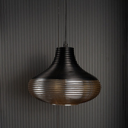 Red glass pendant light with gold cap shown against black background perfect for adding elegance to modern spaces.