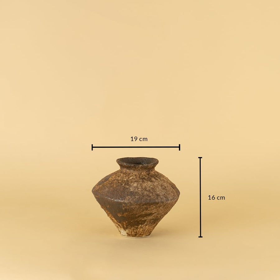 Rustic brown ceramic vase with handcrafted texture shown with 16 cm height and 19 cm width for size reference.