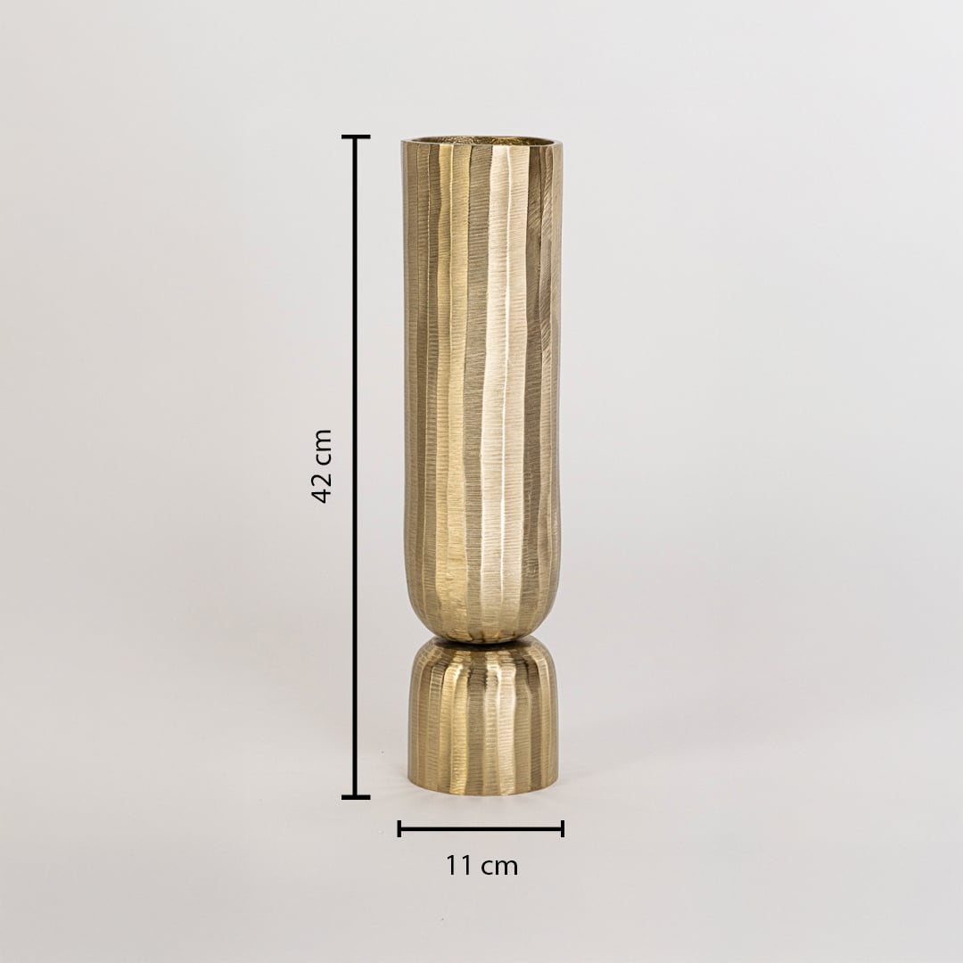 Decorative gold vase measuring 42 cm high and 11 cm wide with vertical ribbed texture shown on white background wall
