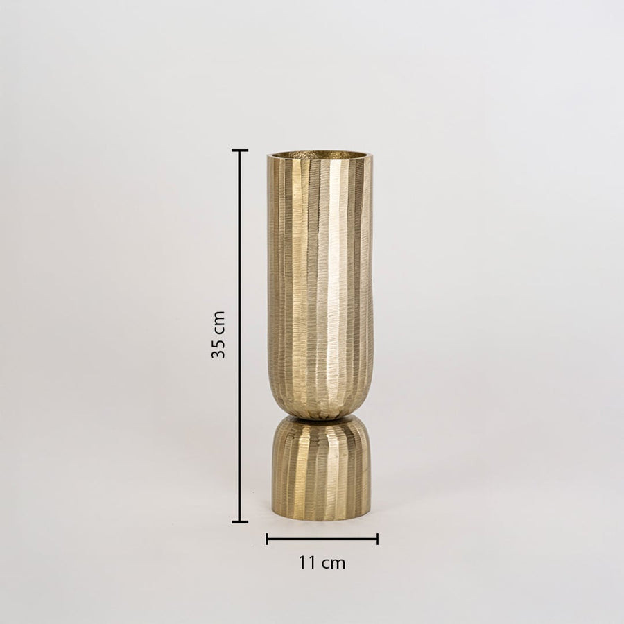 Gold decorative vase measuring 35 cm tall and 11 cm wide with sculpted pedestal base shown on clean white wall