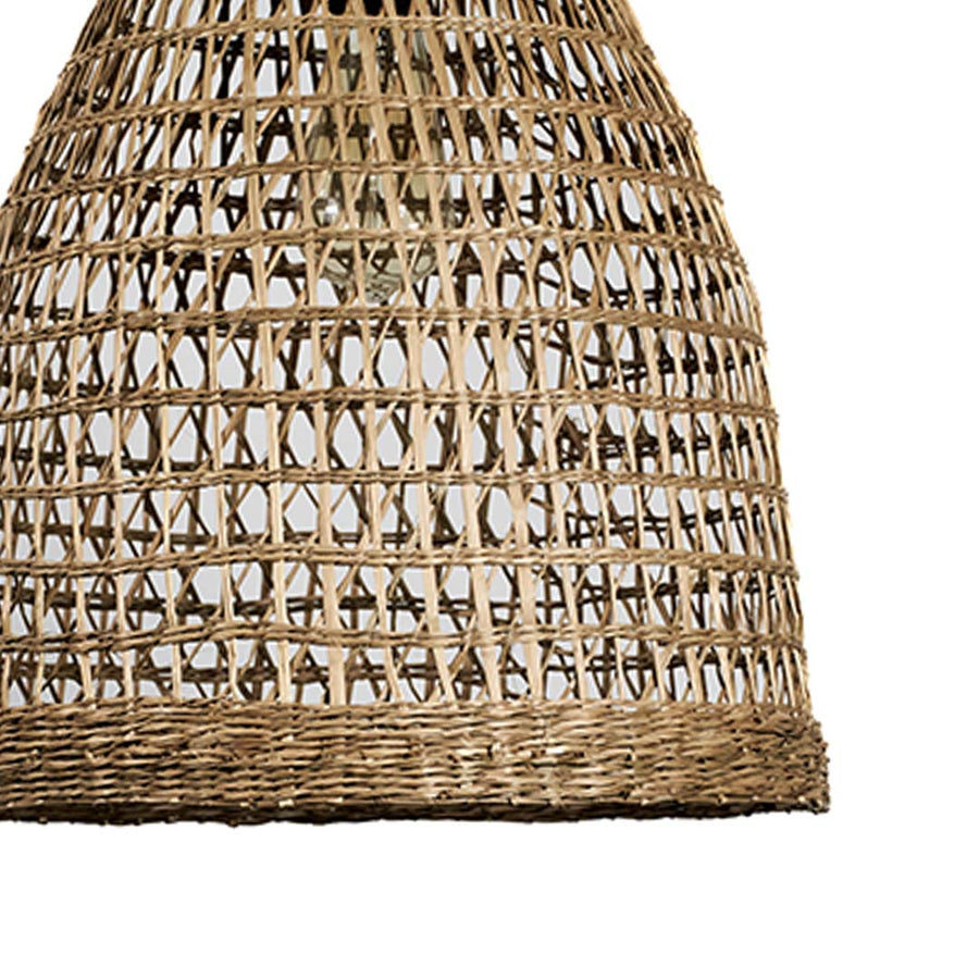 Closeup of woven rattan pendant light showing natural texture and craftsmanship for boho style home lighting decor.