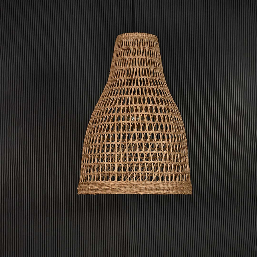 Natural rattan pendant ceiling lamp switched off on back background for modern bohemian dining and living room decor.