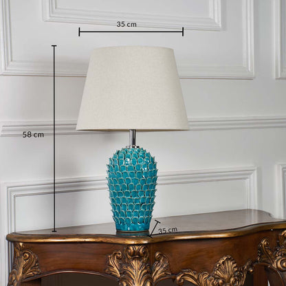 Turquoise textured ceramic table lamp shown with 58 cm height 35 cm shade width and 35 cm base width on a wooden console for accurate size reference.