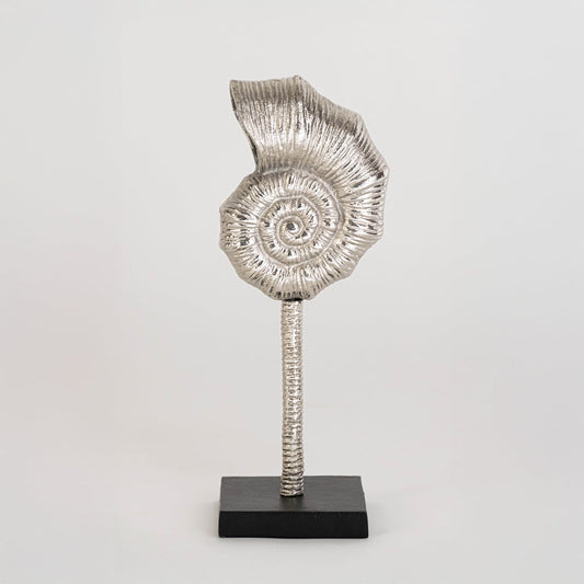 Modern silver swirl accent piece on a sturdy black base photographed on a white background highlighting its elegant handcrafted finish