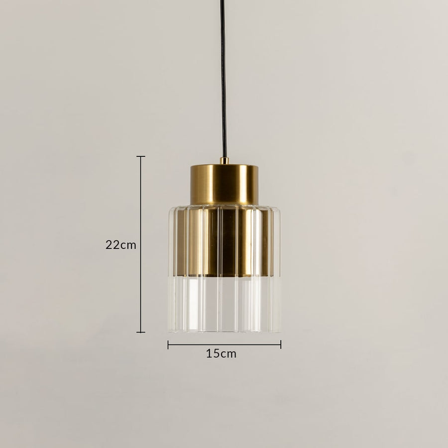 Gold metal and clear glass pendant light dimension image with 15 cm width and 22 cm height for bedside placement.