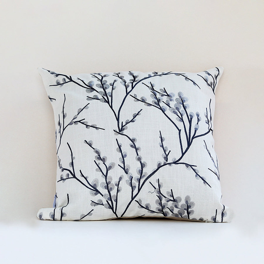 White cotton cushion cover with navy coral branch print showcasing soft cotton fabric and refined stitched craftsmanship.