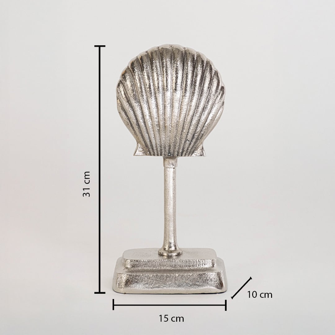 Silver seashell decor piece on base measuring 31 cm high 15 cm wide and 10 cm deep shown against white backdrop