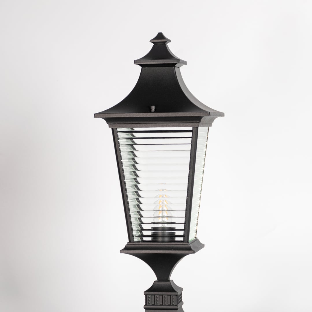 Closeup of black pillar light showing ribbed glass and sleek frame for a premium modern outdoor look.