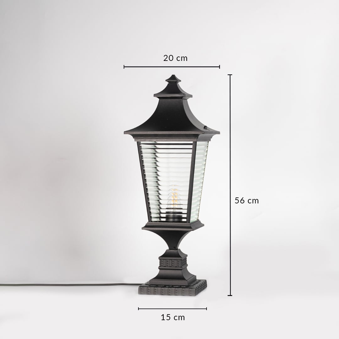 Black pillar light with ribbed glass measuring 56 cm height and 20 cm width ideal for outdoor pillar mounting.