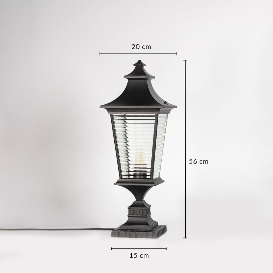 Black pillar light with ribbed glass measuring 56 cm height and 20 cm width ideal for outdoor pillar mounting.