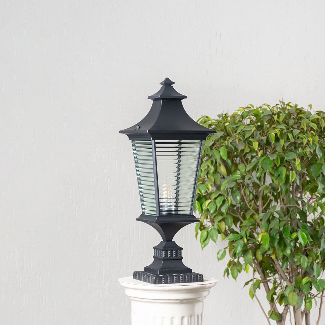 Black pillar light with ribbed glass shown switched off highlighting its elegant structure for outdoor spaces.