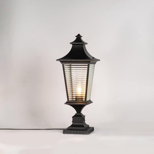 Classic black outdoor gate light with warm glowing bulb for stylish exterior decor styling use.