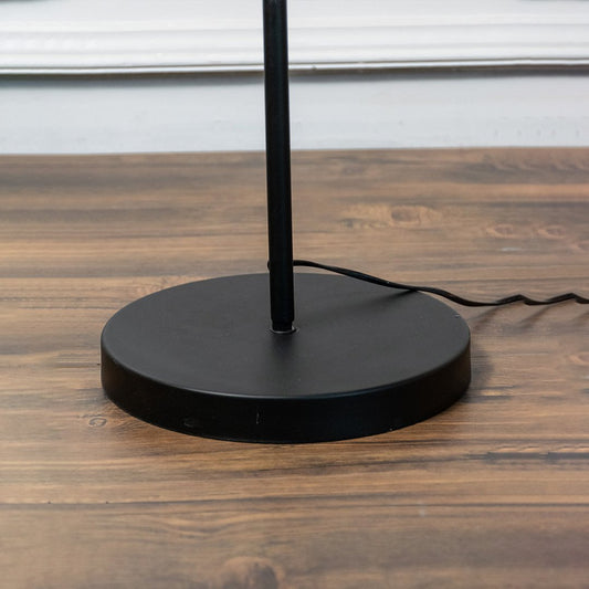 Round matte black metal floor lamp base with durable steel construction displayed on white background.