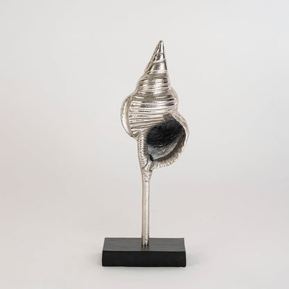 Silver metal conch sculpture shown on a bright white background enhancing its polished textured finish for stylish contemporary home decor.