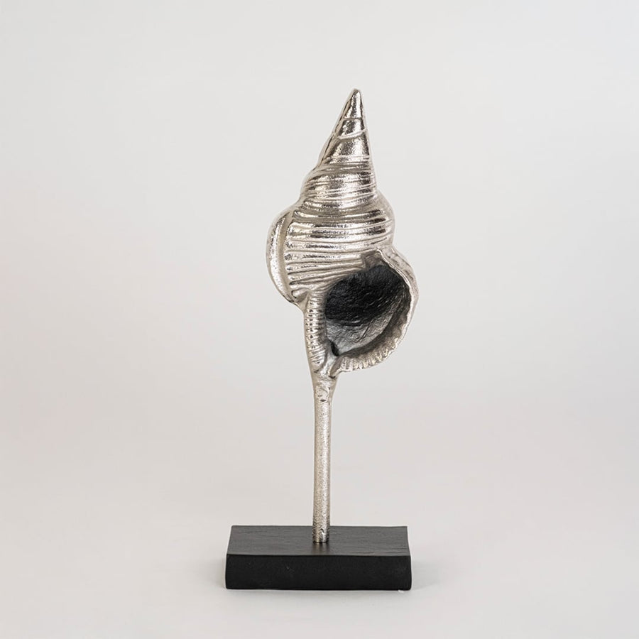 Silver metal conch sculpture shown on a bright white background enhancing its polished textured finish for stylish contemporary home decor.