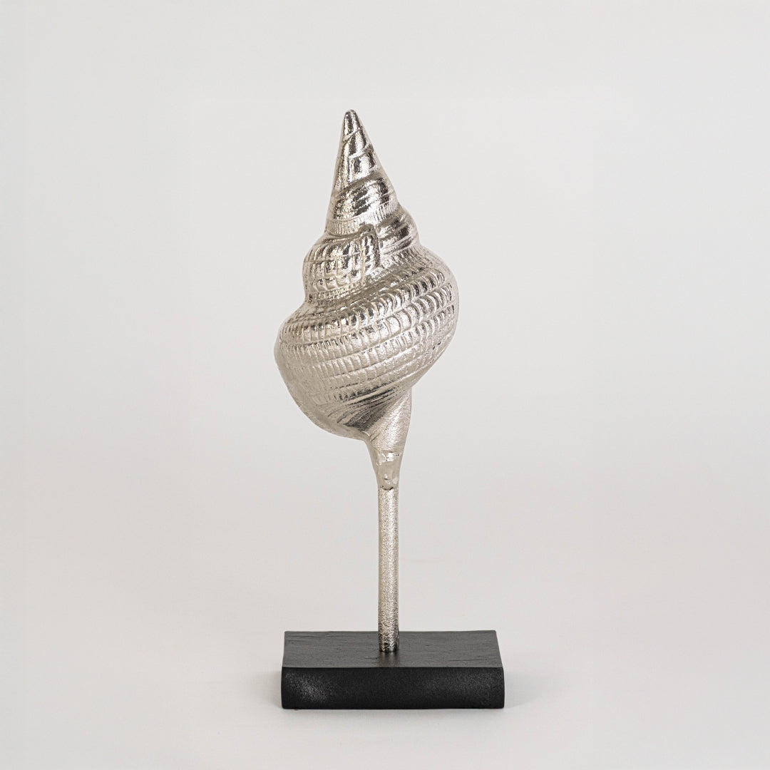 Artistic shell sculpture in silver finish with stand for table decor or shelf styling modern home placement white background.