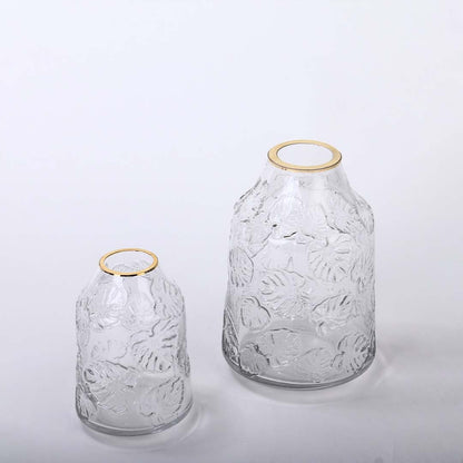 Set of transparent embossed glass vases with golden rim grouped image ideal for modern home table decoration styling.