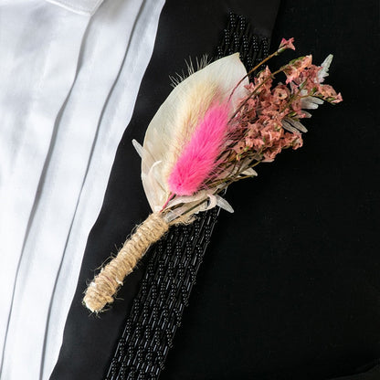 Handmade dried flower boutonniere with preserved pink bloom natural foliage and jute wrap perfect for groom wedding accessory.