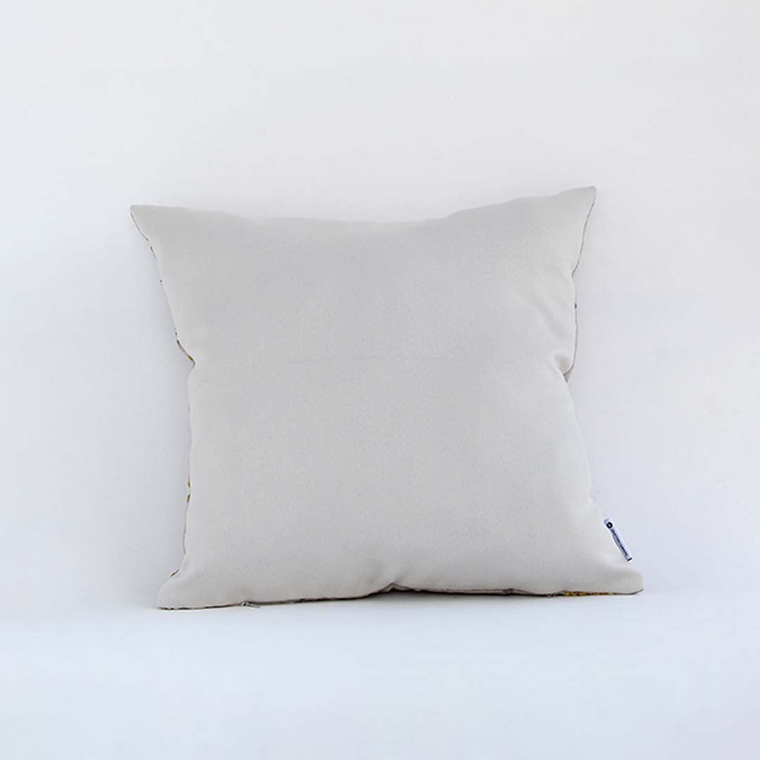 Side view of the floral cushion displaying its plump filled shape and elegant embroidered pattern.