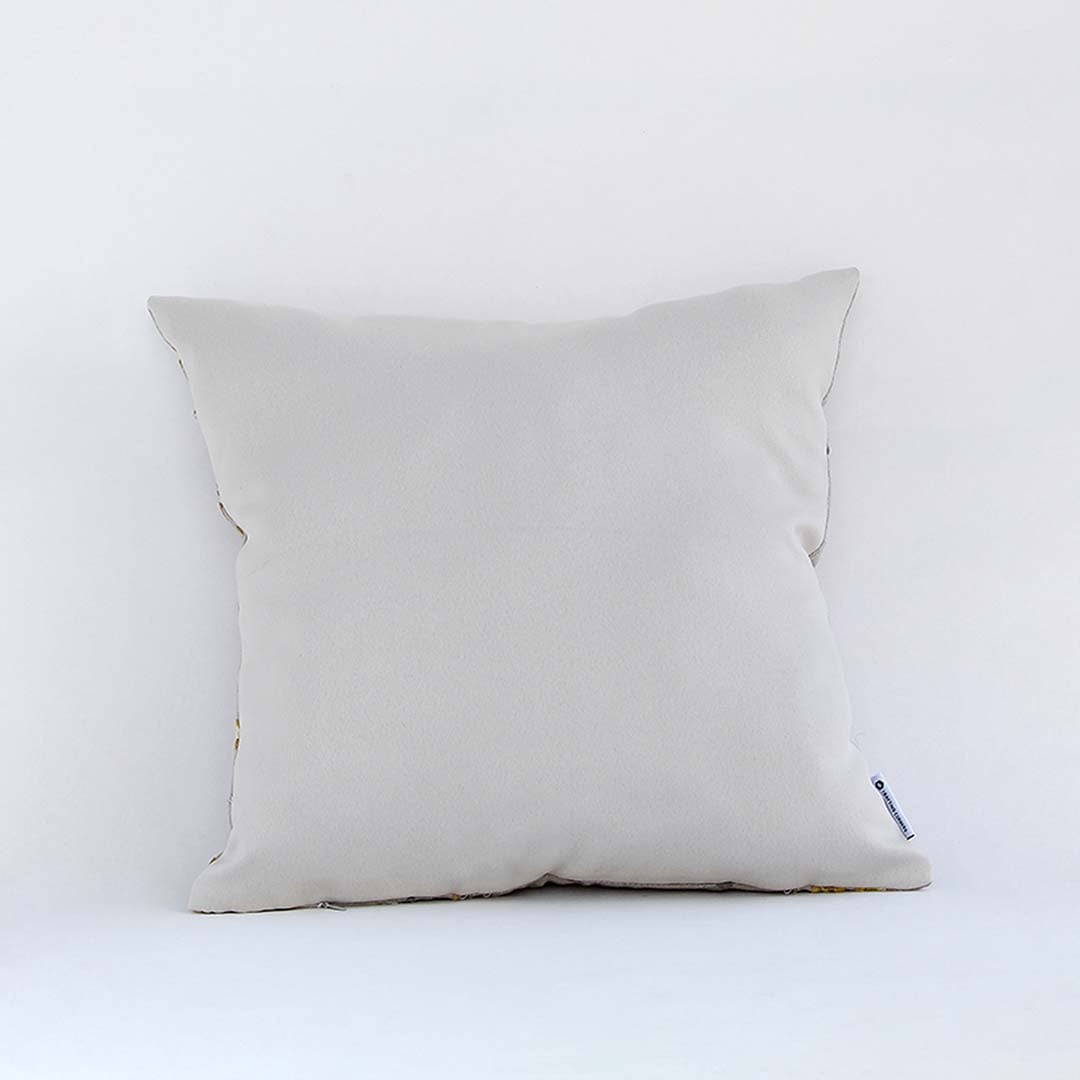 Back view of cotton cushion featuring red and grey embroidered floral motifs showing soft plush texture and fine stitching ideal for sofa and bed styling.