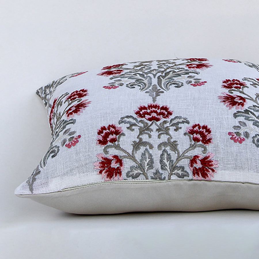 Closeup view of cotton cushion embroidery showing detailed red and grey floral stitching and soft textured fabric perfect for elegant home decor accents.