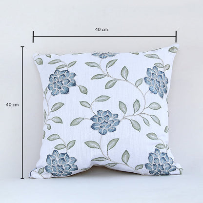 Cotton cushion with blue floral embroidered design measured at 40 cm by 40 cm displayed on a white background showing its square decorative shape.