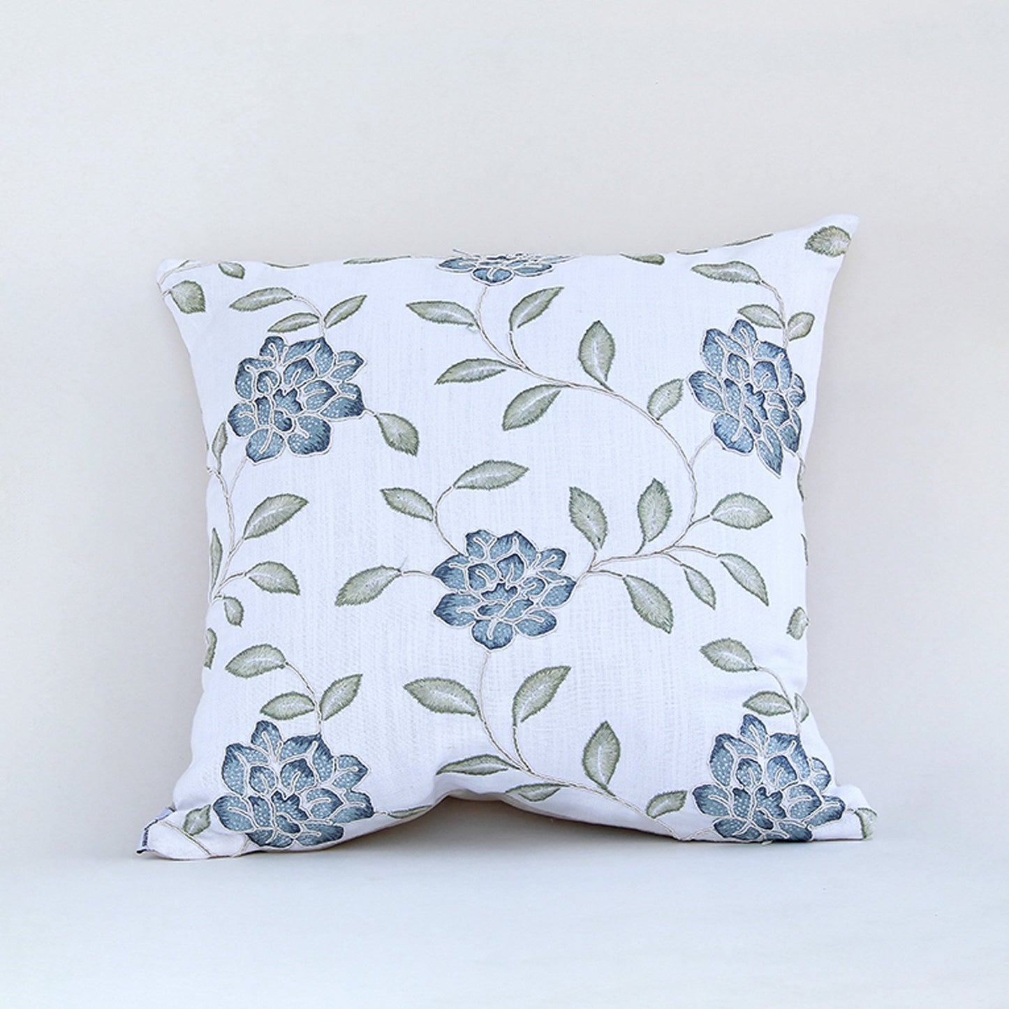 White cotton cushion cover with soft grey botanical leaf print for sofa couch bedroom and elegant interior styling.