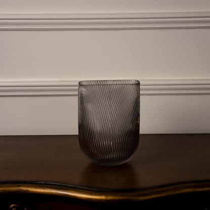 Contemporary smoky gray decorative glass vase featuring vertical ribbed detailing and rounded base shown on white background.