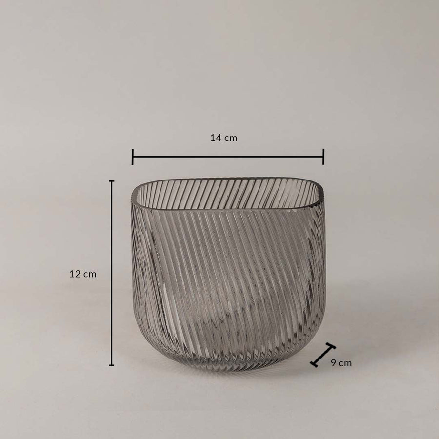 Smoky gray ribbed glass vase measuring 12 cm in height  14 cm in width  and 9 cm in depth shown with dimensions.