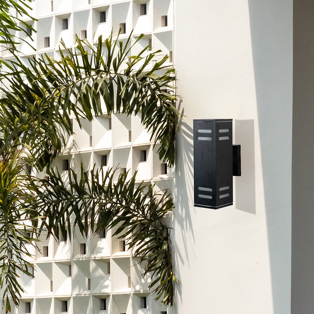 Contemporary outdoor black rectangular wall light enhancing entryways with subtle warm illumination and elegance.