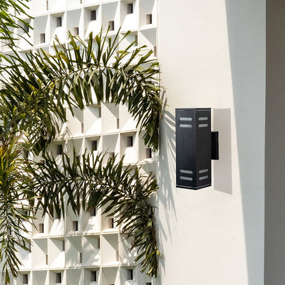Contemporary outdoor black rectangular wall light enhancing entryways with subtle warm illumination and elegance.